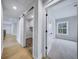 Hallway leading to a bedroom and laundry area with a sliding barn door at 175 Paislee Park (Lot # 11 Paislee Park) Dr, Fayetteville, GA 30215