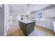 Modern kitchen with white cabinets, stainless steel appliances, and a large center island at 175 Paislee Park (Lot # 11 Paislee Park) Dr, Fayetteville, GA 30215