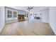 Cozy living room featuring a stone fireplace, large windows, and hardwood flooring at 175 Paislee Park (Lot # 11 Paislee Park) Dr, Fayetteville, GA 30215