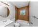 Bathroom featuring a single sink vanity, tiled shower, and gray walls at 190 Sunrise Cir, Riverdale, GA 30274
