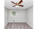 Bedroom featuring neutral carpeting, a ceiling fan, gray walls, and a window at 190 Sunrise Cir, Riverdale, GA 30274