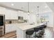 Modern kitchen with an island, granite countertops, stainless steel appliances, with bar stool seating at 3564 Nathan Farm Ln, Buford, GA 30519