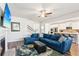 Spacious living room with an open layout, hardwood floors, and a view of the kitchen at 3564 Nathan Farm Ln, Buford, GA 30519