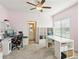Bright office space with custom built-ins, neutral carpet, and fan at 3564 Nathan Farm Ln, Buford, GA 30519