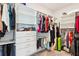 Walk-in closet with custom shelving and plenty of space for clothes, shoes, and accessories at 3564 Nathan Farm Ln, Buford, GA 30519