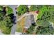 Aerial view of home showcasing lush landscaping, circular driveway, and proximity to nearby neighborhood streets at 5567 Stapleton Dr, Dunwoody, GA 30338