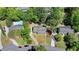 Aerial view showcasing the property's landscaping, driveway, and neighboring homes, including one with a pool at 5567 Stapleton Dr, Dunwoody, GA 30338