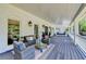 Inviting covered patio with comfortable seating, stylish decor, and a relaxing porch swing at 5567 Stapleton Dr, Dunwoody, GA 30338