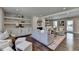 Bright and airy living room with custom built-ins, a fireplace, and plush seating at 5567 Stapleton Dr, Dunwoody, GA 30338