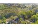 Aerial view of a luxurious home on a large lot with mature trees and a manicured lawn at 177 Grandmar Chase, Canton, GA 30115