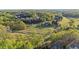 Picturesque aerial view of homes nestled within a golf course community showcasing lush greenery and mature trees at 177 Grandmar Chase, Canton, GA 30115