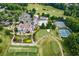 Stunning aerial view of a golf community, clubhouse, swimming pool and tennis courts at 177 Grandmar Chase, Canton, GA 30115