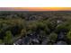An aerial view shows the property surrounded by a lush landscape with mature trees at 177 Grandmar Chase, Canton, GA 30115