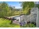Beautifully landscaped backyard with an inground pool and view of the golf course at 177 Grandmar Chase, Canton, GA 30115