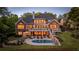 Stunning backyard with pool, firepit, lush landscaping, and multi-level deck at 177 Grandmar Chase, Canton, GA 30115