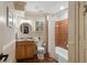 Bathroom with warm tile, providing a bathtub/shower combination, and decorative accents at 177 Grandmar Chase, Canton, GA 30115