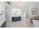 Expansive bathroom with double vanities, a free-standing tub, and a separate shower area with luxurious fixtures at 177 Grandmar Chase, Canton, GA 30115
