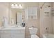 Cozy bathroom features vanity with mirror, neutral cabinets, and a shower-tub combination at 177 Grandmar Chase, Canton, GA 30115