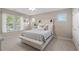 Comfortable bedroom features natural light from large windows and calming neutral tones at 177 Grandmar Chase, Canton, GA 30115