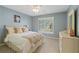 Tranquil bedroom features a window with shutters, plush bedding, and soft blue walls at 177 Grandmar Chase, Canton, GA 30115