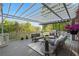 Outdoor deck featuring shade trellis, patio furniture, and a built-in grill at 177 Grandmar Chase, Canton, GA 30115