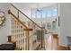Grand foyer with a staircase, large windows, and an elegant chandelier at 177 Grandmar Chase, Canton, GA 30115