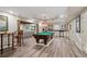 Spacious game room featuring a pool table, bar area, and access to the living area at 177 Grandmar Chase, Canton, GA 30115