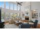 Spacious living room with high ceilings, a stone fireplace, and large windows at 177 Grandmar Chase, Canton, GA 30115