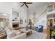 Open-concept living room with a stone fireplace, large windows, and ample seating at 177 Grandmar Chase, Canton, GA 30115
