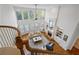 Soaring two-story living room with large windows, fireplace, hardwood floors, and comfortable seating area at 177 Grandmar Chase, Canton, GA 30115