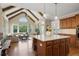 Open-concept space with beamed ceilings, a seating area, and kitchen island at 177 Grandmar Chase, Canton, GA 30115