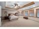 Serene bedroom featuring neutral tones, tray ceiling, and large windows providing ample natural light at 177 Grandmar Chase, Canton, GA 30115