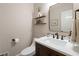 Stylish powder room featuring modern fixtures, floating shelves, and a sleek vanity with a white countertop basin sink at 177 Grandmar Chase, Canton, GA 30115