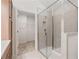 Bathroom with a tiled glass shower, walk-in closet, and wooden cabinets at 1216 Cedarcrest Blvd, Acworth, GA 30101