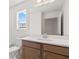 Bathroom featuring tile floors, vanity with sink, and a large mirror above the counter at 1216 Cedarcrest Blvd, Acworth, GA 30101