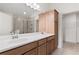 Bathroom featuring double sinks, tile floors, vanity, glass shower, and a walk-in closet at 1216 Cedarcrest Blvd, Acworth, GA 30101
