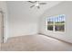 Bright bedroom featuring vaulted ceilings, large windows, neutral carpet, and freshly painted walls at 1216 Cedarcrest Blvd, Acworth, GA 30101