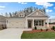 Charming single-Gathering home with a well-manicured lawn, two-car garage, and a welcoming front porch at 1216 Cedarcrest Blvd, Acworth, GA 30101