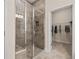 Tiled shower with glass door and a walk-in closet are visible in this bathroom at 1220 Cedarcrest Blvd, Acworth, GA 30101