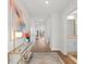 Bright entryway with hardwood floors, stylish decor, and view into the home's open-concept layout at 1220 Cedarcrest Blvd, Acworth, GA 30101