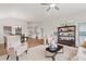 Open-concept living space with hardwood floors, neutral decor, and seamless flow to the kitchen at 1220 Cedarcrest Blvd, Acworth, GA 30101