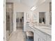 Spa-like bathroom with double vanity, granite countertops, and a glass-enclosed shower at 1220 Cedarcrest Blvd, Acworth, GA 30101