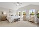 Serene bedroom featuring vaulted ceiling, plush carpet, and ample natural light from multiple windows at 1220 Cedarcrest Blvd, Acworth, GA 30101