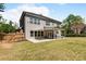 Large backyard featuring a covered patio and well-maintained lawn perfect for entertaining at 1862 Lake Ebenezer Trl, Marietta, GA 30066