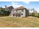 Beautiful backyard featuring a covered patio and a spacious lawn, perfect for outdoor living and entertaining at 1862 Lake Ebenezer Trl, Marietta, GA 30066