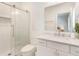 Bathroom featuring a glass shower, white tiles, and a marble floor at 1862 Lake Ebenezer Trl, Marietta, GA 30066