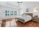 Bright bedroom boasts hardwood floors, tray ceiling, and large windows offering natural light at 1862 Lake Ebenezer Trl, Marietta, GA 30066