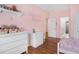 bedroom with hardwood floors and attached bathroom at 1862 Lake Ebenezer Trl, Marietta, GA 30066