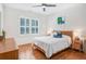 Bedroom featuring hardwood floors and natural light at 1862 Lake Ebenezer Trl, Marietta, GA 30066
