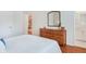 Bedroom with hardwood floors, a dresser, and ensuite bathroom at 1862 Lake Ebenezer Trl, Marietta, GA 30066